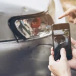Certified auto appraiser inspecting a vehicle for diminished value claims