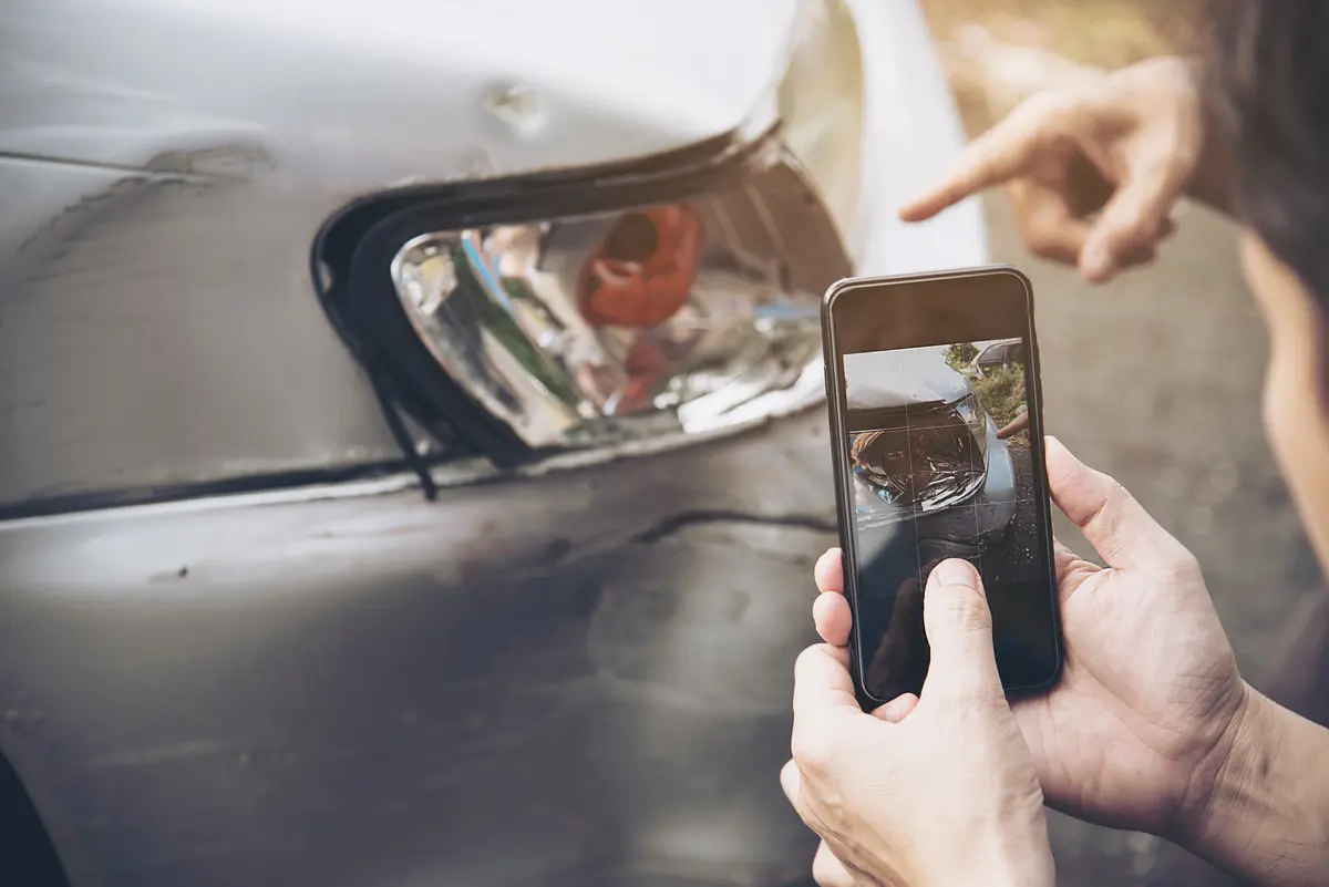 Certified auto appraiser inspecting a vehicle for diminished value claims
